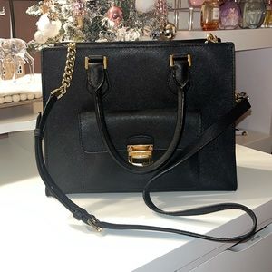 Gorgeous black Michael Kors bag with gold hardware that fits it all!